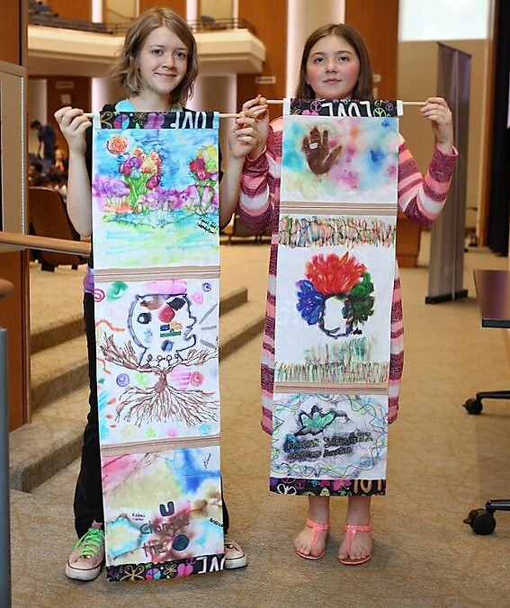 gatton-satyarthi-lexi-and-majessa-holding-scrolls-cropped